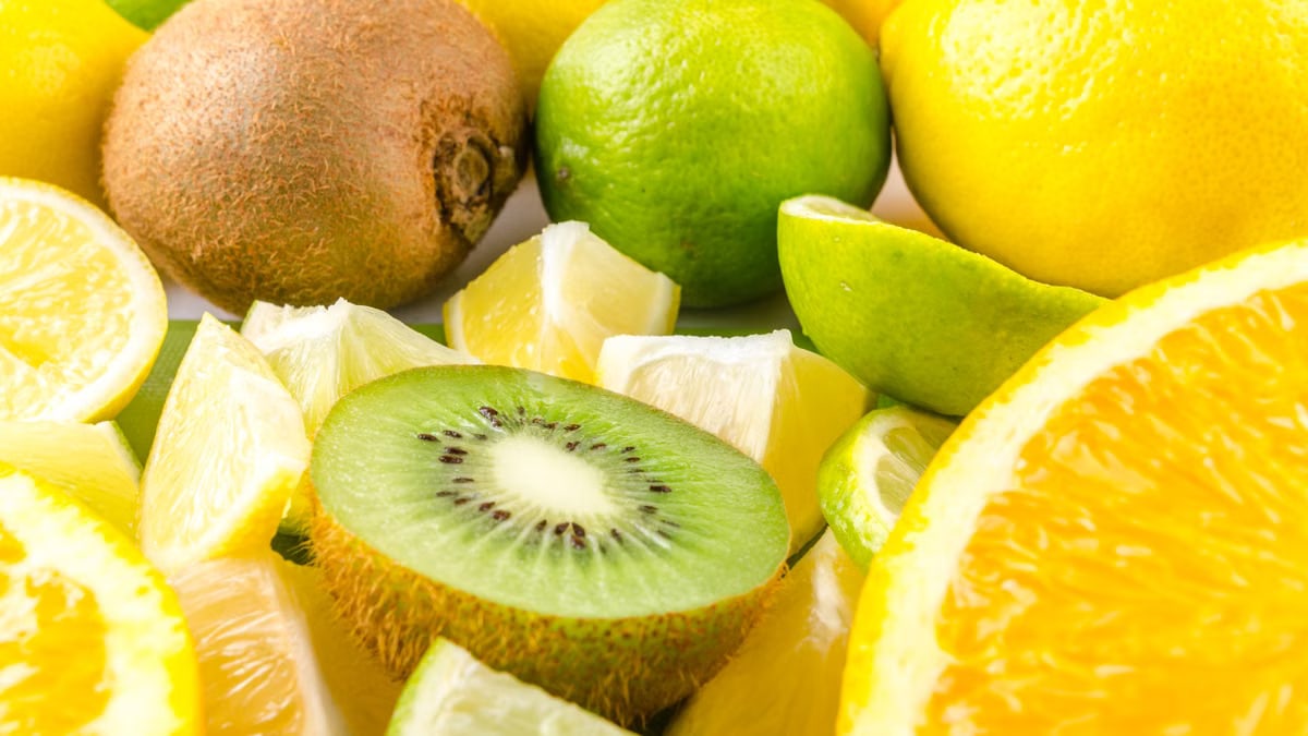 Colorful mix of sliced citrus fruits and kiwi, showcasing freshness and tropical abundance.